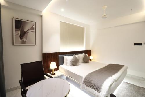 Ένα ή περισσότερα κρεβάτια σε δωμάτιο στο Hotel Lémore Stay & Dine