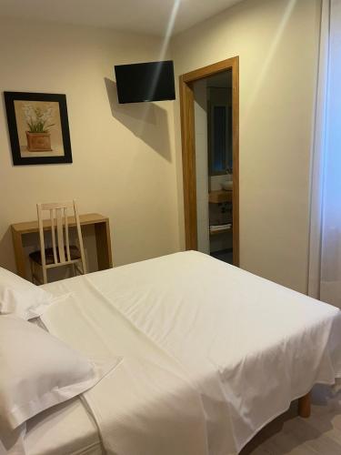 Ένα ή περισσότερα κρεβάτια σε δωμάτιο στο Hotel Casa Román
