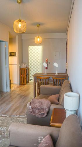 a living room with a couch and a table at MainStreet, VintageGroup in Espinho