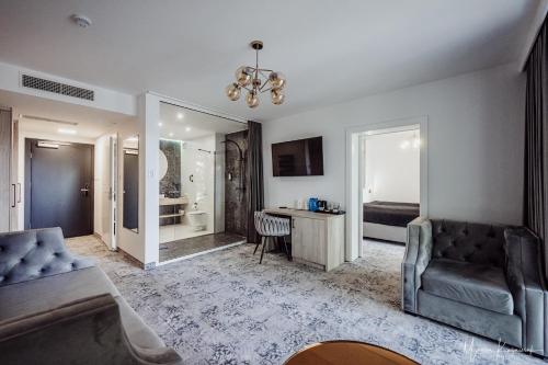 a living room with a couch and a bedroom at Cristal in Ustka