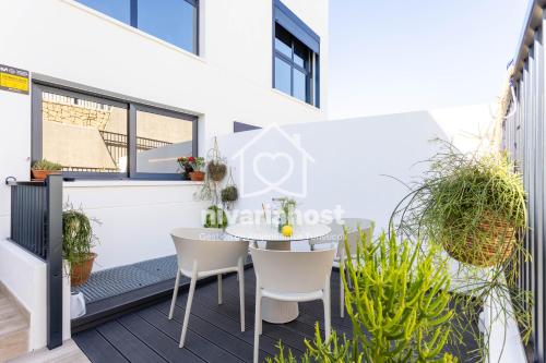 a view of a balcony with a table and chairs at The Oasis El Medano, by Nivariahost in El Médano
