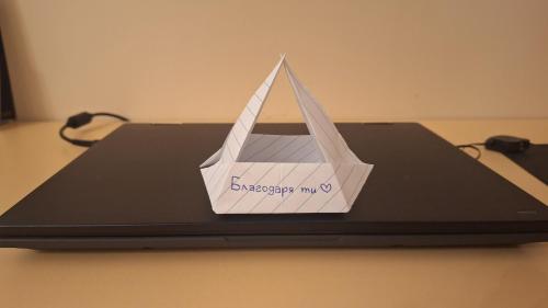 a paper boat on top of a laptop computer at Casa Ferrari Bed & Breakfast in Sofia