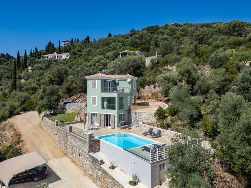 an aerial view of a house with a swimming pool at Koumaries Villas in Lygia