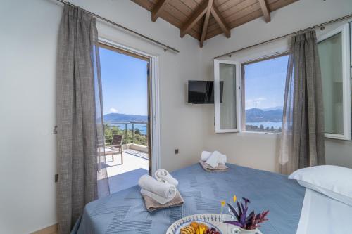 Postel nebo postele na pokoji v ubytování Koumaries Villas