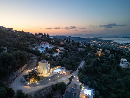 an aerial view of a house with lights on at Koumaries Villas in Lygia