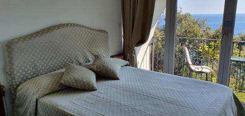 Postel nebo postele na pokoji v ubytování Albergo La Conca Azzurra