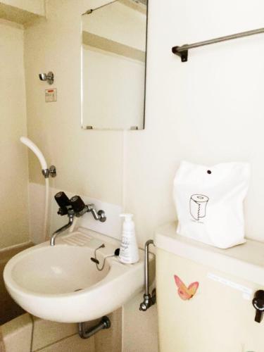 a bathroom with a sink and a mirror at Free bike and free WIFI 304 Take it easy in Kyoto
