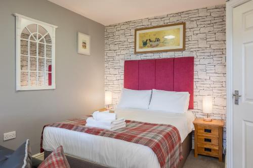 Katil atau katil-katil dalam bilik di Rocklands Lodges