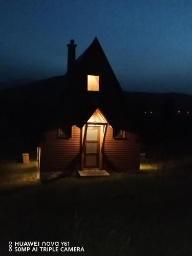 a house at night with a light on the door at Vila Dajana Zminica in Žabljak