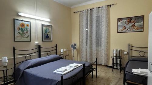 Postel nebo postele na pokoji v ubytování Albergo Fiorita