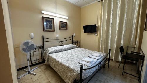 Ein Bett oder Betten in einem Zimmer der Unterkunft Albergo Fiorita