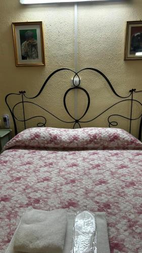 Ein Bett oder Betten in einem Zimmer der Unterkunft Albergo Fiorita