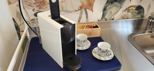 Příslušenství pro přípravu čaje a kávy v ubytování B&B El Brumista Due