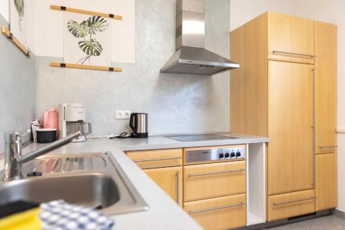 a kitchen with a sink and a stove top oven at Ferienhaus Frankenglueck in Egloffstein