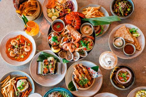 a table full of plates of food on a table at JW Marriott Clearwater Beach Resort & Spa in Clearwater Beach