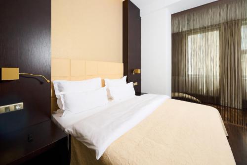 Cama o camas de una habitación en MyPlace Premium Apartments