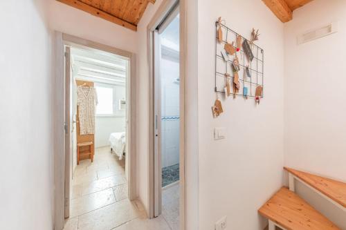 a hallway with a door leading to a bedroom at Elena's house 28 in Polignano a Mare
