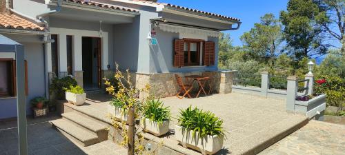 a small white house with a patio at Villa Capllonch in Banyalbufar