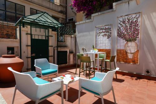 a patio with chairs and a table and a table and chairs at Casa Acropoli Sea View Taormina Center in Taormina