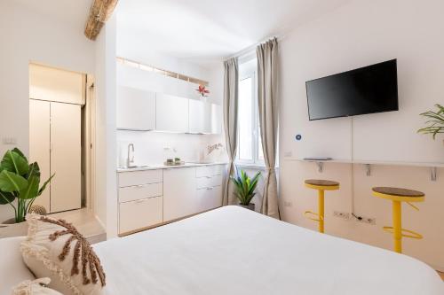 En eller flere senge i et værelse på Cantoni 4B - Studio at Colosseum