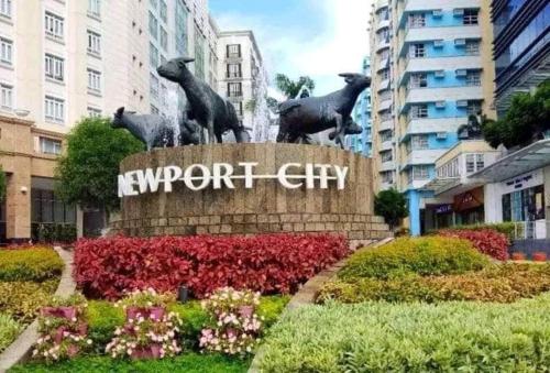 a statue of three sheep with the words support city at H&M One Palmtree Villas in Manila