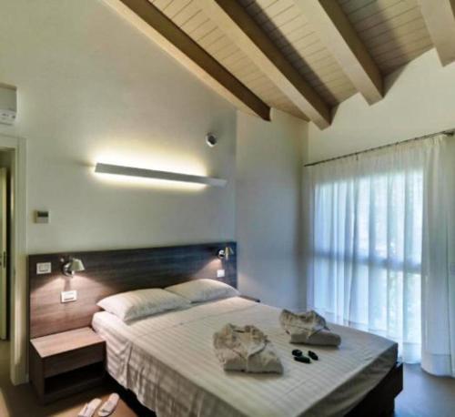 Un pat sau paturi într-o cameră la Locanda La Gazzella
