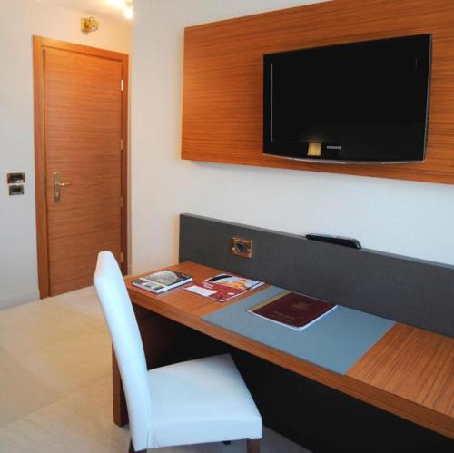 TV a/nebo společenská místnost v ubytování Astra Hotel