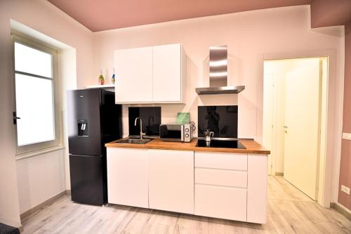 Kuchyň nebo kuchyňský kout v ubytování Tigullio Suites Rapallo