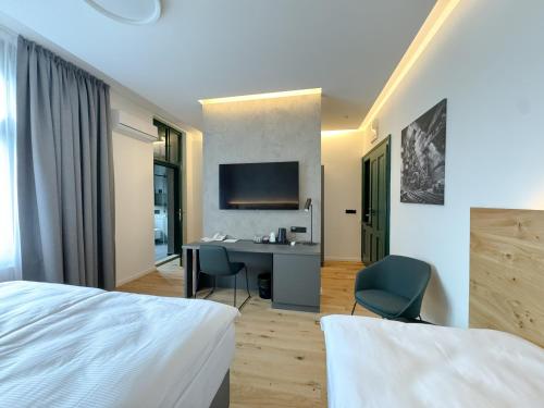 Postel nebo postele na pokoji v ubytování Jan Maria Hotel
