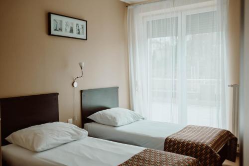 Postel nebo postele na pokoji v ubytování Hotel Liburnia