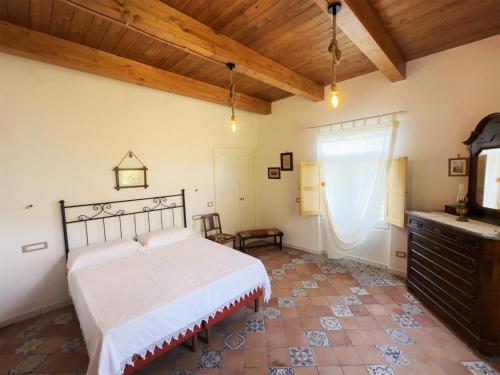 a bedroom with a bed and a tv in a room at Casa Sangineto - Minori - Costa Amalfitana- A Paradise in the countryside in Minori