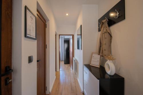 a hallway with a hallway leading into a room with a hallway at Hyggemate - 2 Bed Room Warm Stay in Sarnitsa in Sarnitsa