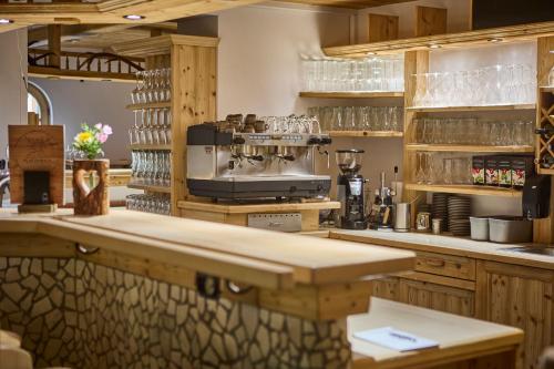 a kitchen with a counter with a coffee maker at Platzhirsch Rooms - B&B - SELF CHECK-IN in Piesendorf
