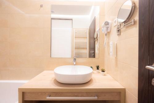 a bathroom with a sink and a mirror at Rooms Bella in Bled
