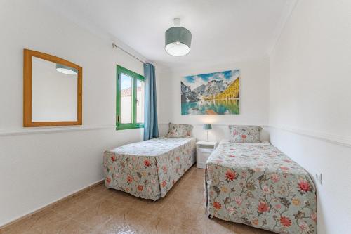 Ένα ή περισσότερα κρεβάτια σε δωμάτιο στο Cozy Spacious SeaView 300m beach