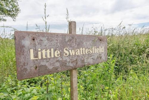 a sign that reads little switzerlandigunigun at Little Swattesfield, Eye in Eye