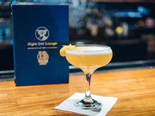 a drink in a glass sitting on a table at Hotel Indigo Vancouver Dwtn - Portland Area by IHG in Vancouver
