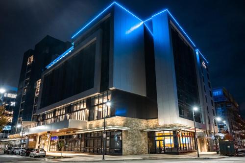 a building with blue lights on top of it at Hotel Indigo Vancouver Dwtn - Portland Area by IHG in Vancouver