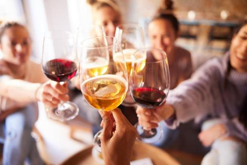 a group of people holding up wine glasses at Hotel Indigo Vancouver Dwtn - Portland Area by IHG in Vancouver