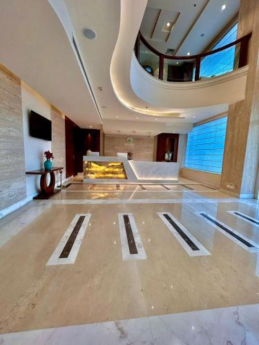 a large room with a fire place in a building at Best Western Plus Amritsar in Amritsar