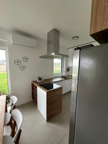 a kitchen with a sink and a counter top at Hacienda R - kuca sa bazenom in Siokovac