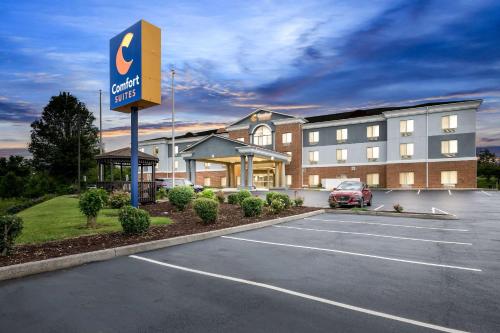 a hotel with a parking lot in front of a building at Comfort Suites Abingdon I-81 in Abingdon