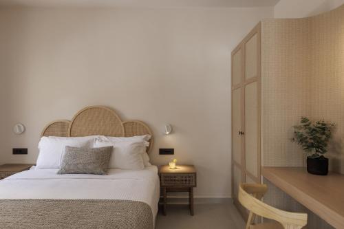 Ένα ή περισσότερα κρεβάτια σε δωμάτιο στο Morfes Luxury Suites by Caldera Houses