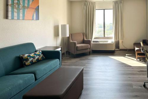 a living room with a couch and a chair at MainStay Suites Conover-Hickory in Conover