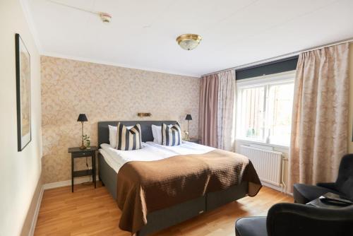 Postel nebo postele na pokoji v ubytování Mullsjö Hotell & Konferens