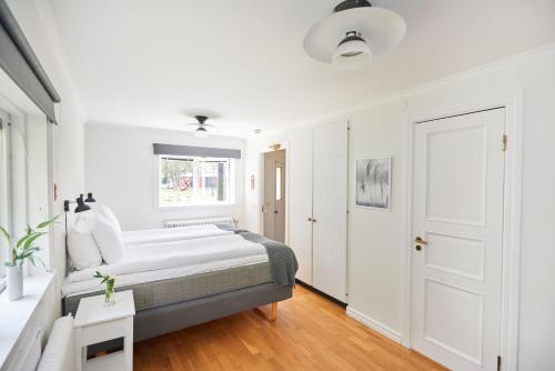 Ein Bett oder Betten in einem Zimmer der Unterkunft Mullsjö Hotell & Konferens