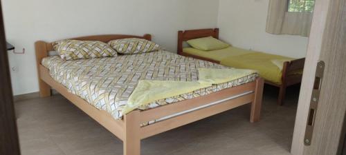 a bedroom with two beds in a room at Adriatic Sunset House in Petrovac na Moru