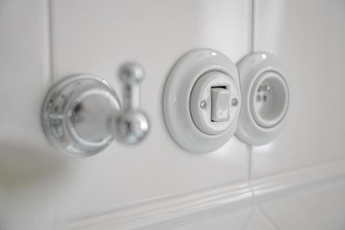 a close up of a bathroomaucet and a sink at Vila Zlatý Slavík - Luxurious Villa with Spa in Jevany