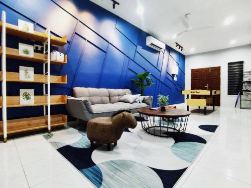 a living room with a couch and a table at 11pax5br Modern 5mins Ipoh Town wPoolTable in Ipoh
