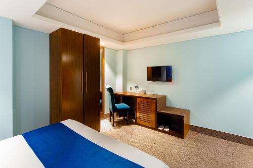 Voodi või voodid majutusasutuse HOTEL THE CAPITAL LTD. toas